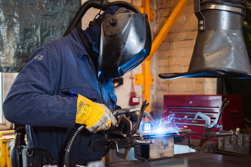 Person welding with helmet on