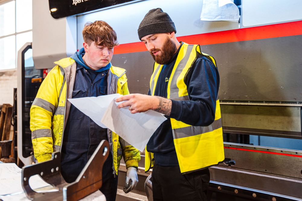 grenville_engineering_full_fabrication_training Apprentice rotating through metal fabrication processes at Grenville Engineering