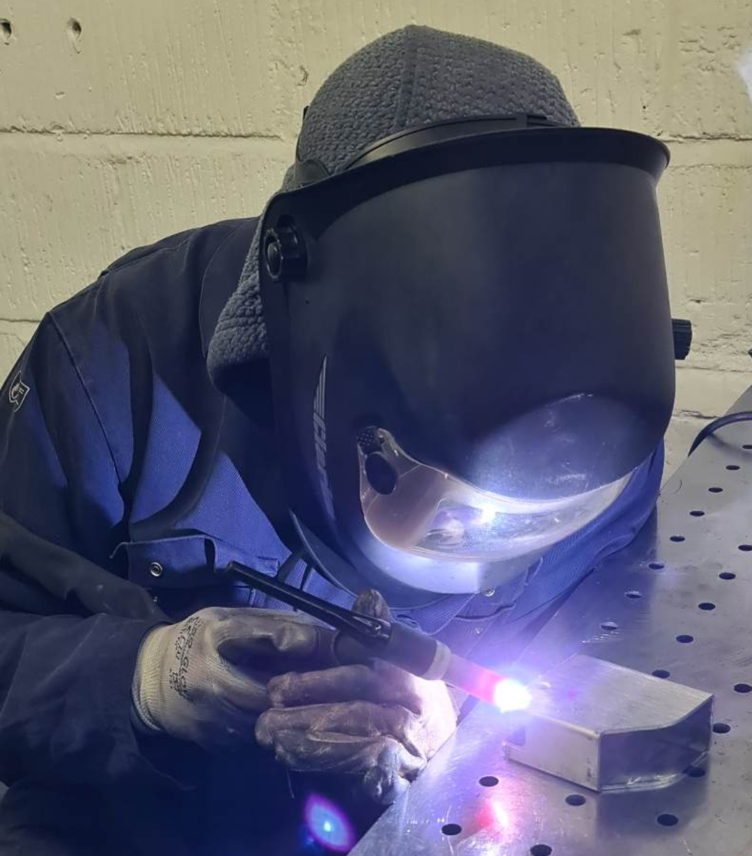 Harry carrying out plate welding on the shop floor at Grenville Engineering.