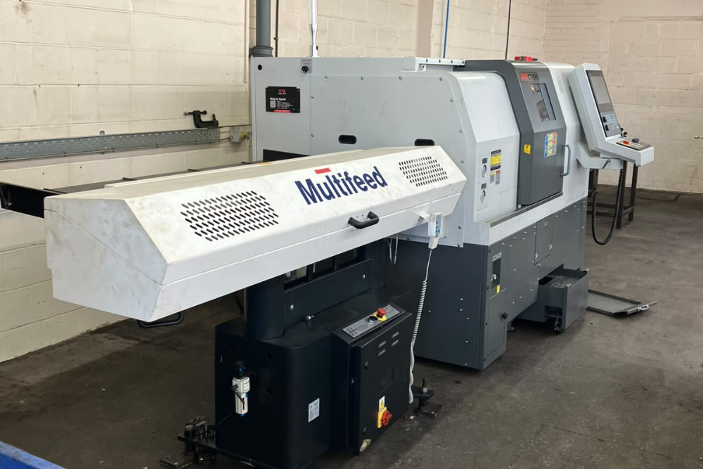 XYZ CT 65 HD CNC lathe with its bar feeder at Grenville Engineering