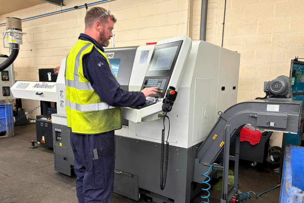 Operator pictured with the XYZ CT 65 HD CNC lathe in Grenville Engineering’s machine shop.
